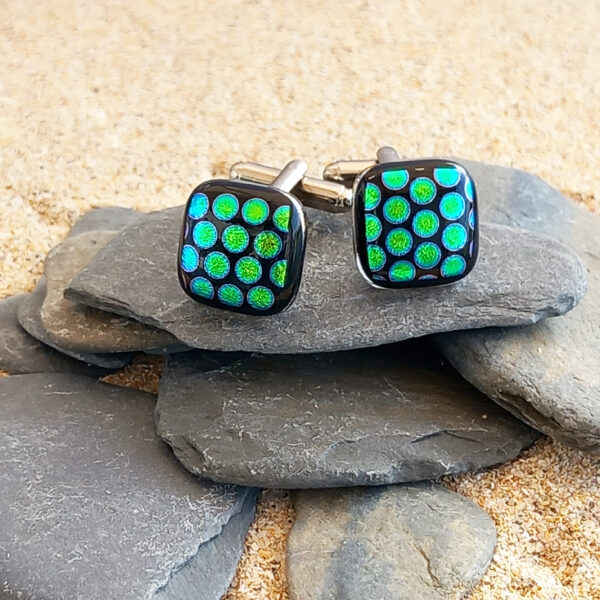 cufflinks green dot on pebbles